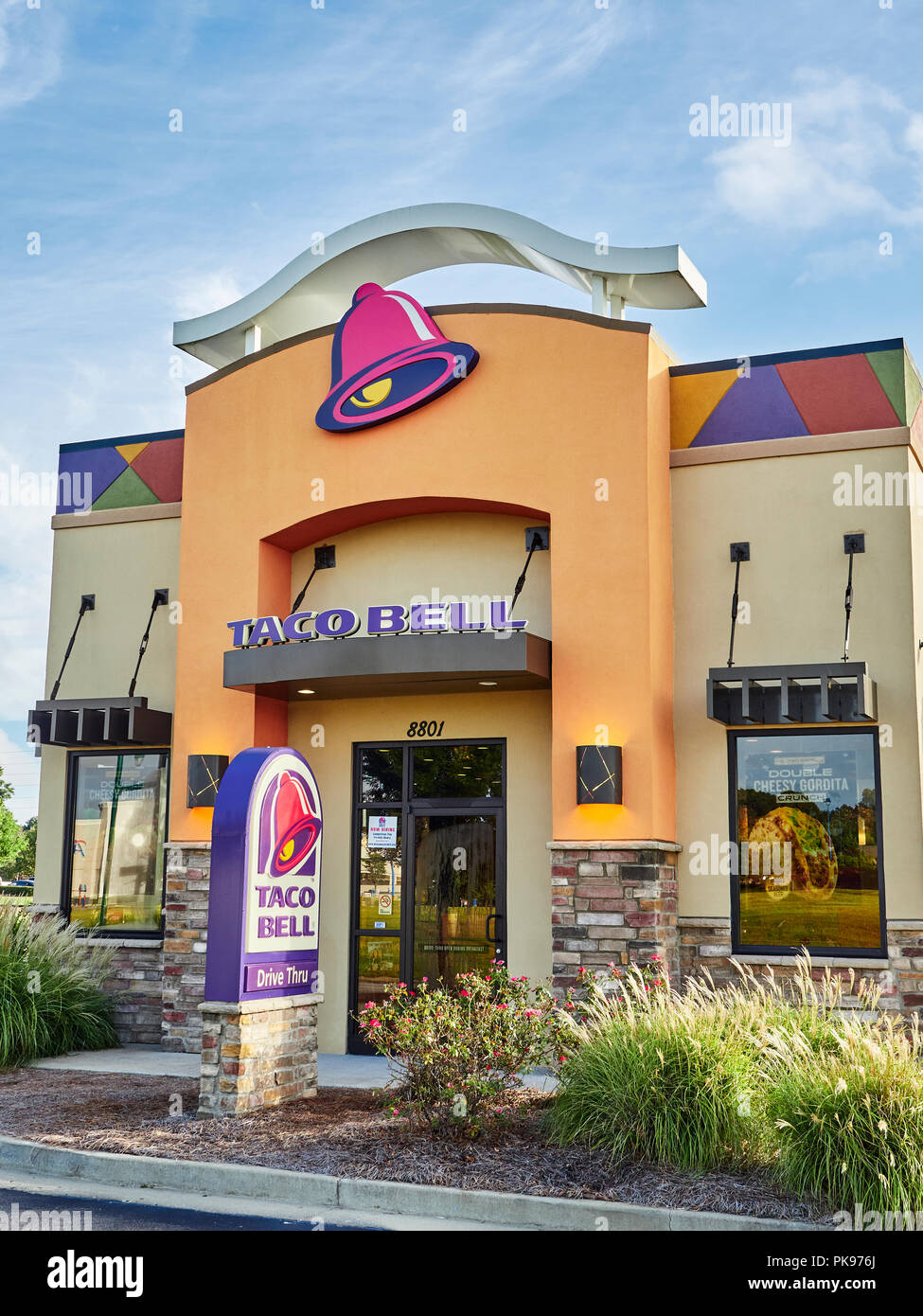 Exterior front entrance to fast food restaurant Taco Bell showing the corporate logo and current design in Montgomery, Alabama USA. Stock Photo
