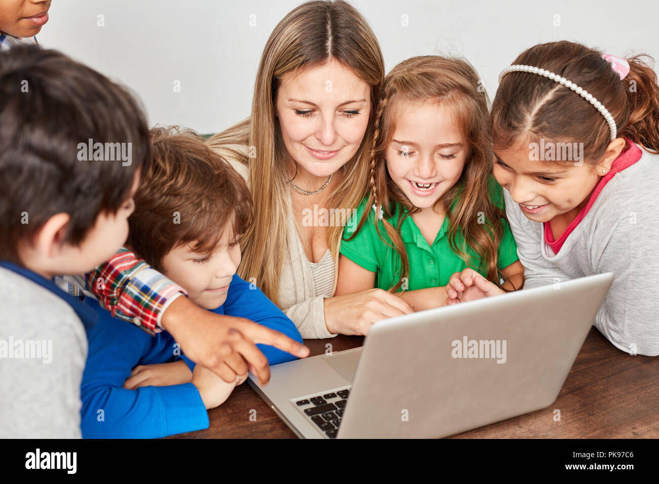 Students have fun at laptop PC in computer science lessons at elementary school Stock Photo