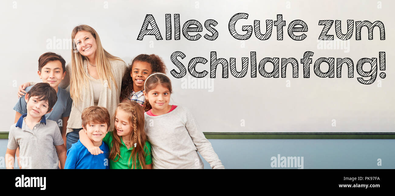 German text 'Alles Gute zum Schulanfang' (all the best for back to school) with class of schoolchildren Stock Photo