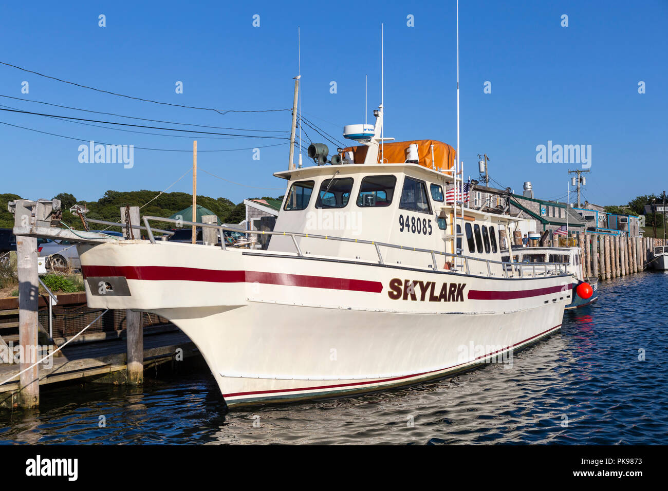 Head boat 'Skylark' docked at Dutcher dock in Menemsha Basin, in the fishing village of Menemsha in Chilmark, Massachusetts on Martha's Vineyard. Stock Photo