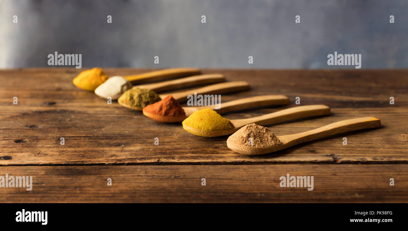 Nutmeg, curry, paprika, cumin, white pepper and turmeric Stock Photo