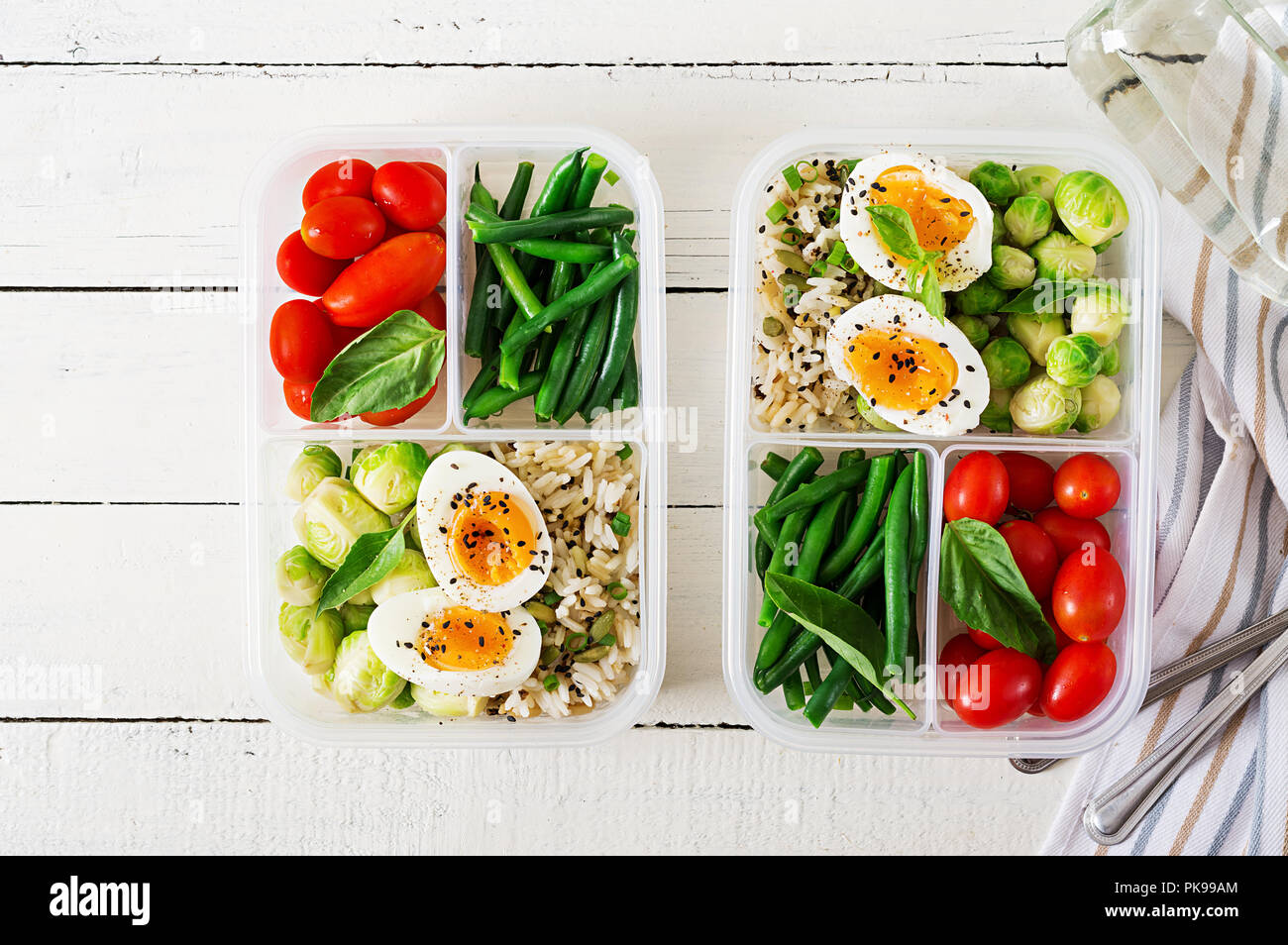 Vegetarian meal prep containers with eggs, brussel sprouts, green beans ...