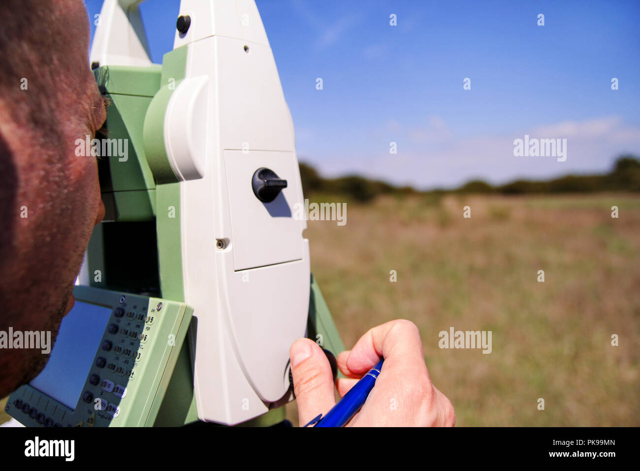 Man surveyor at work and using of total station. Survey Instrument geodetic device, total