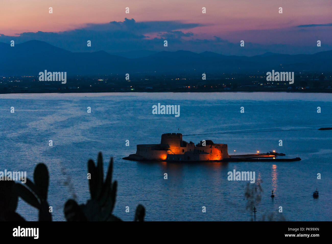 Night view of Bourtzi Castle in the Aegean Sea, Nafplio, Greece Stock Photo