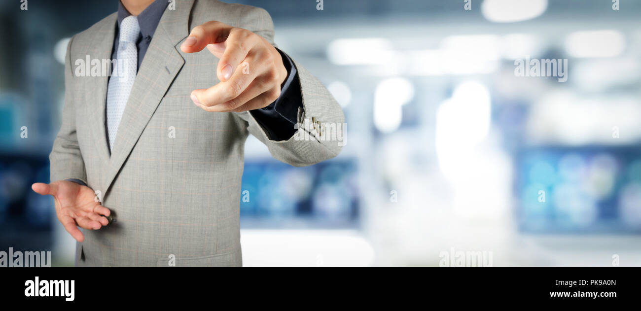 businessman workimg on VR blank wide touch screen computer on office ...