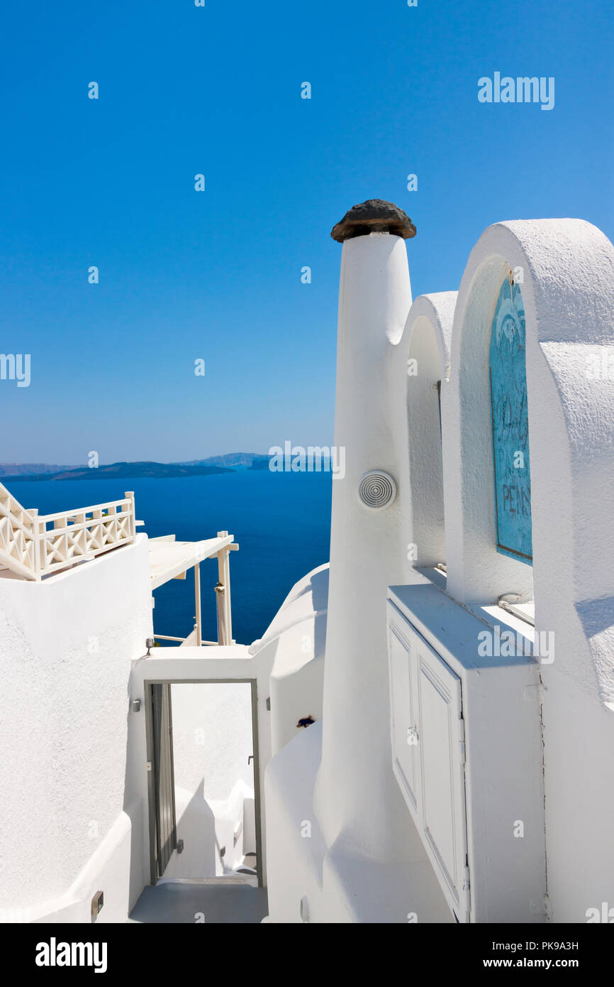 White houses on the coast of Aegean Sea, Oia, Santorini Island, Greece Stock Photo
