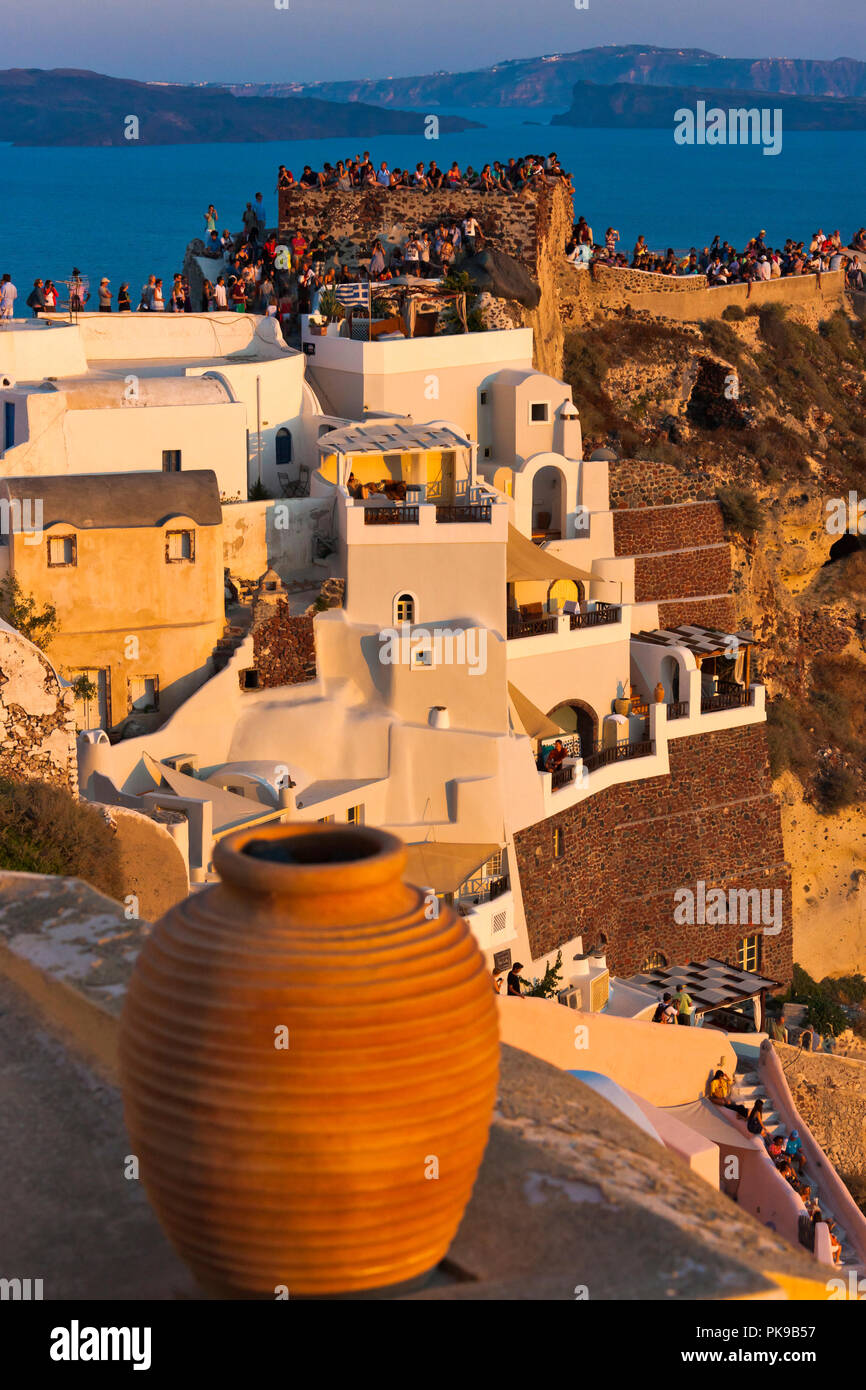 Old fortress and houses on the coast of Aegean Sea, Oia, Santorini Island, Greece Stock Photo