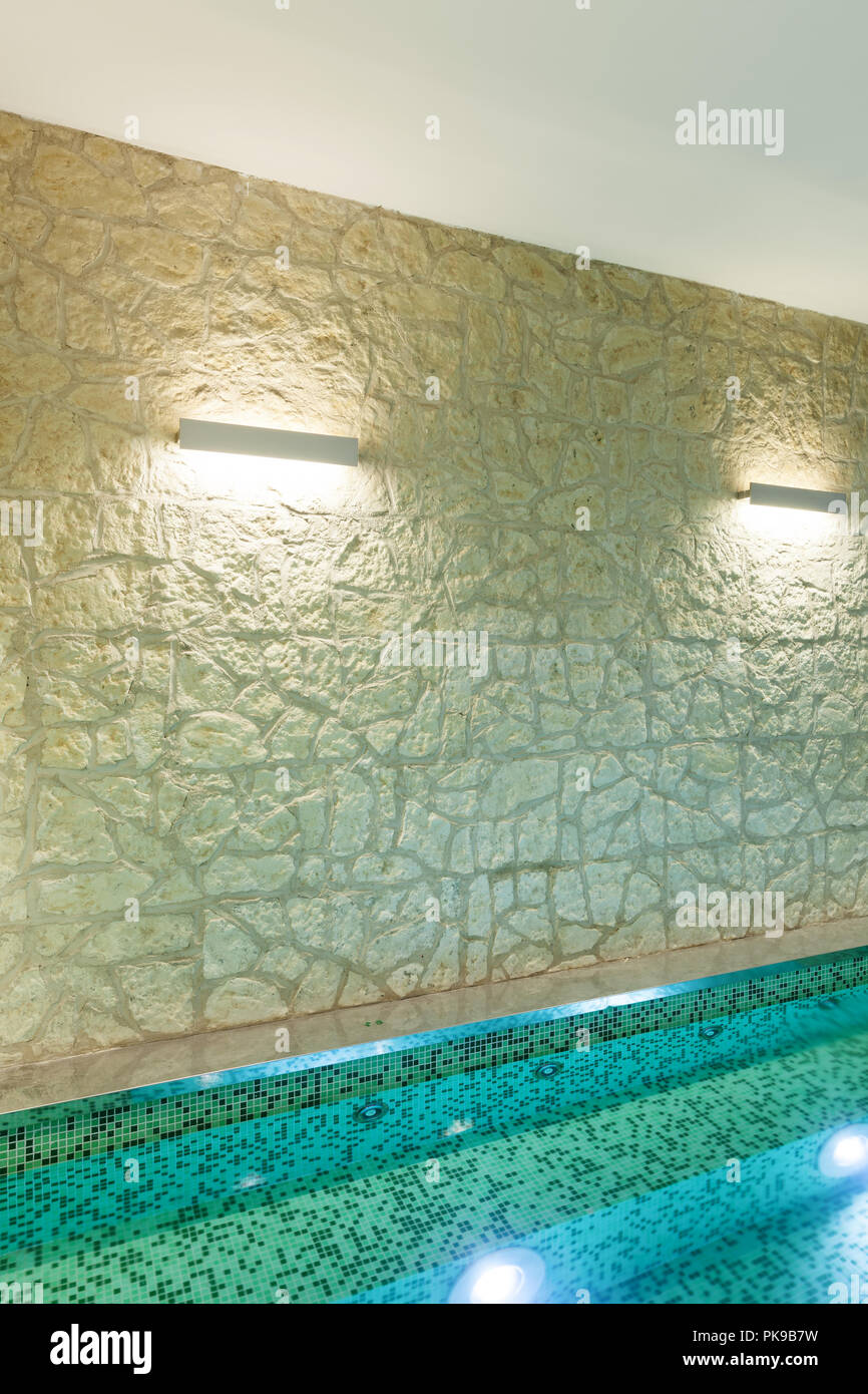 modern hotel spa interior, hot tub, stone wall Stock Photo - Alamy