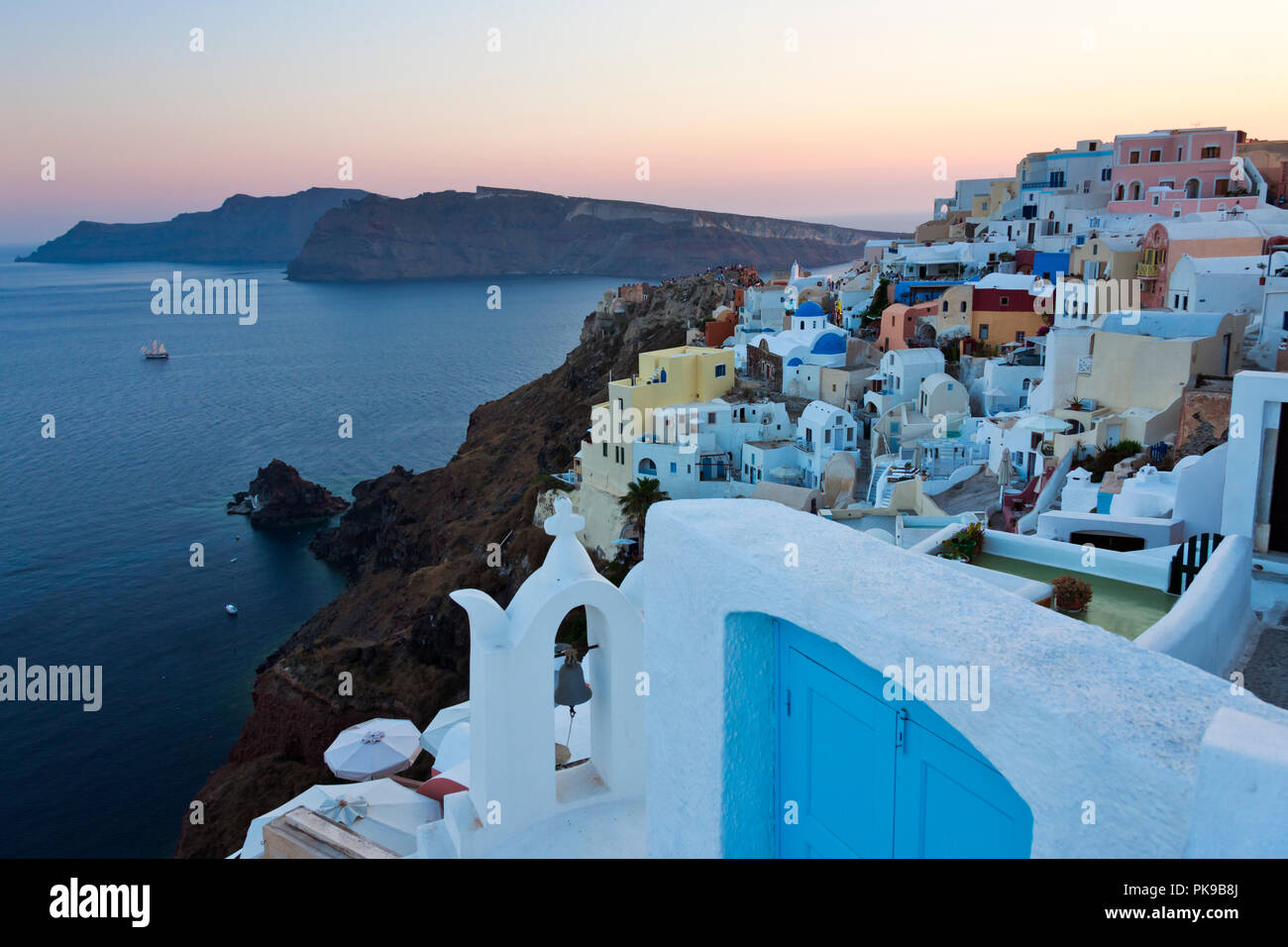 Houses on the coast of Aegean Sea, Oia, Santorini Island, Greece Stock Photo