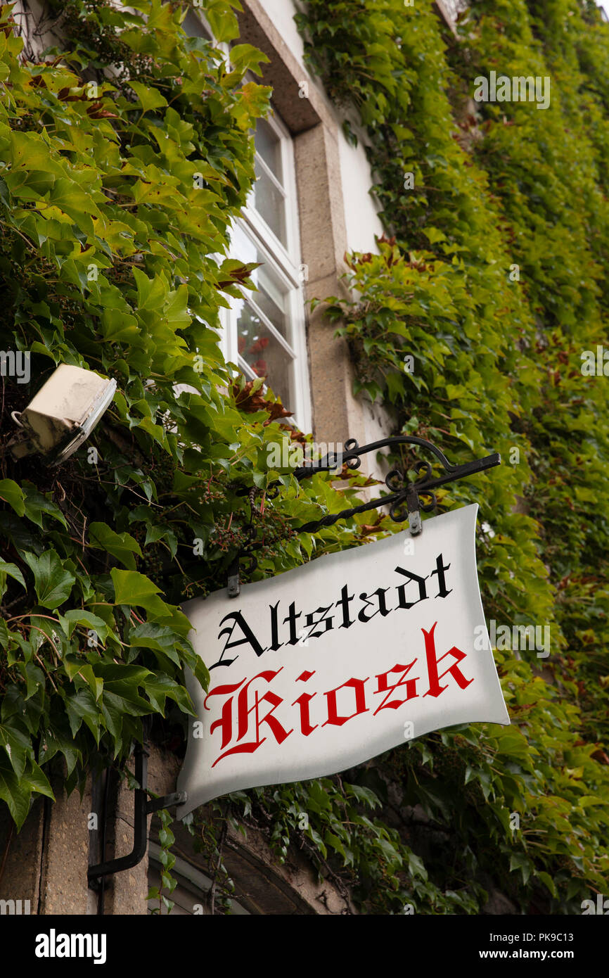sign of a kiosk in the old part of town, Cologne, Germany. Schild eines Kiosk in der Altstadt