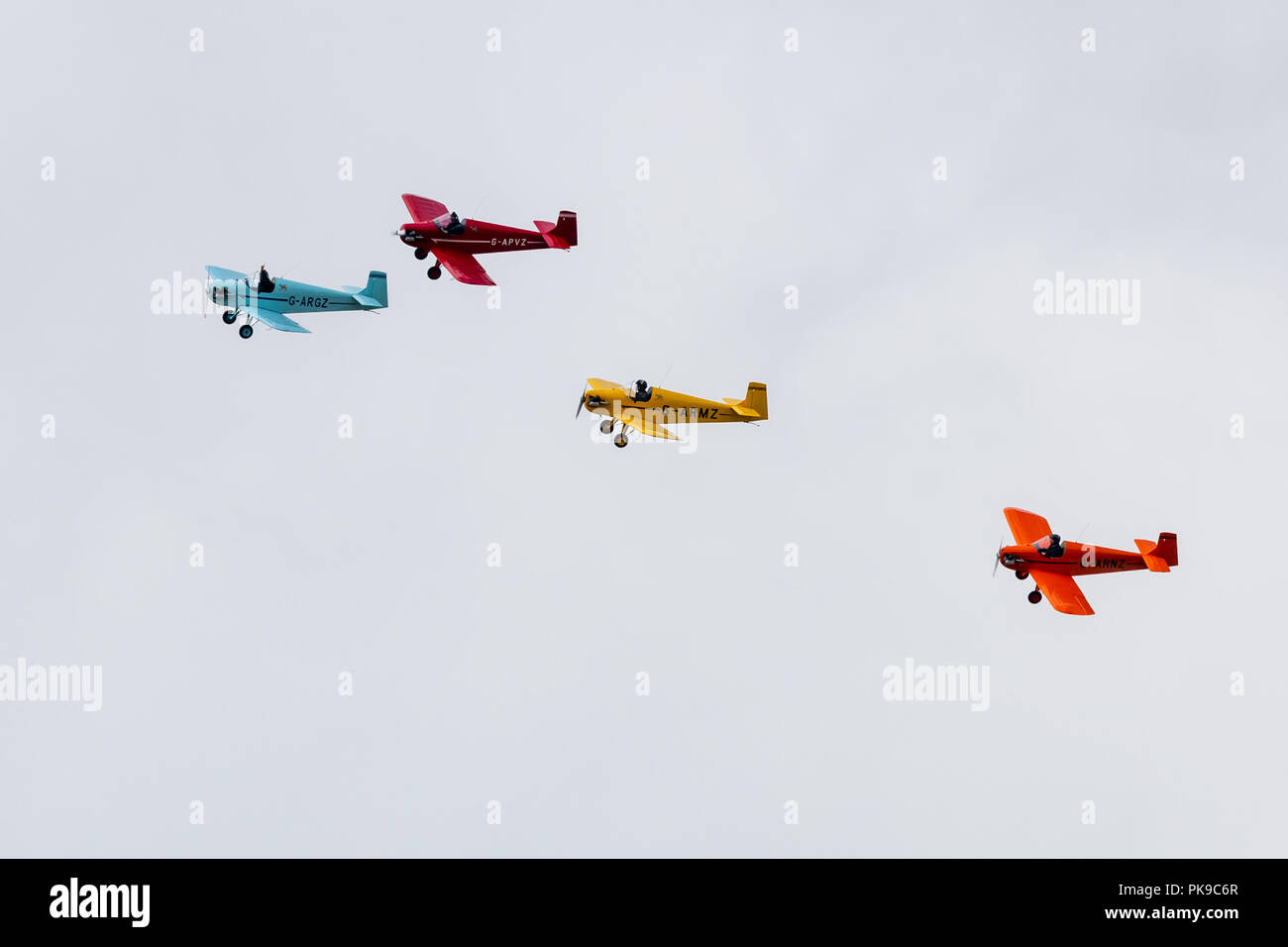 A colourful display of formation flying by the Tiger Club's Turbulent Display Team in their, Roger Druine built, D31 Turbulent single seaters. Stock Photo