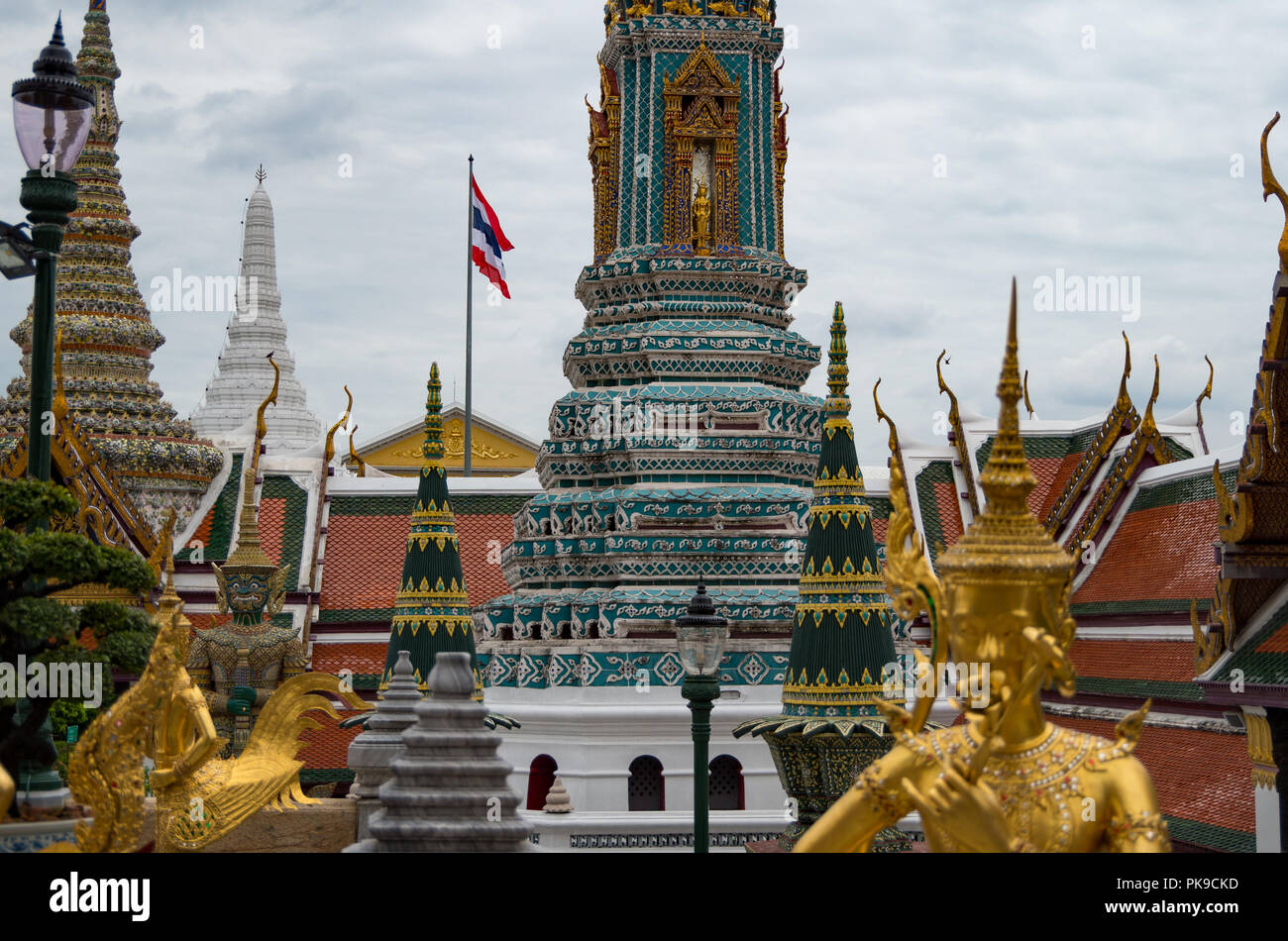 Golden, mythical statue with gemstones in the Grand Palace of Bangkok ...