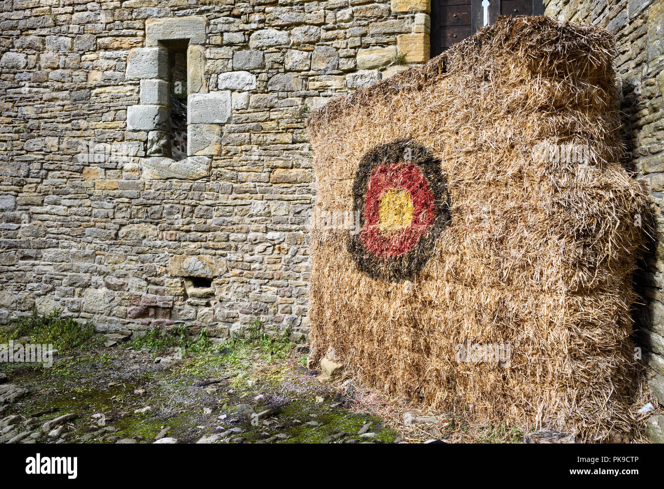 Traditional archery target practice in a medieval setting Stock Photo