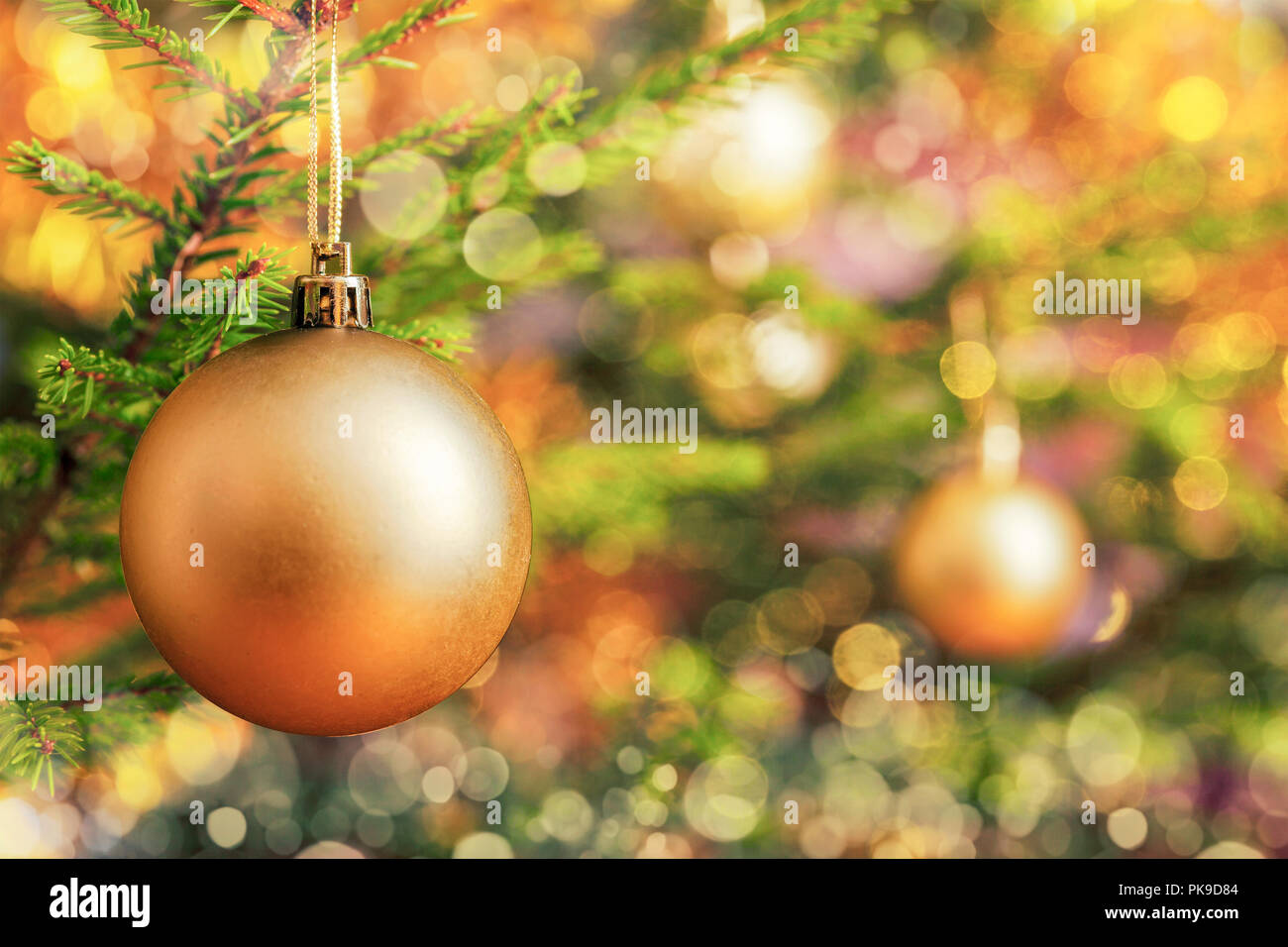 Christmas-tree decoration bauble on decorated Christmas tree bac Stock Photo