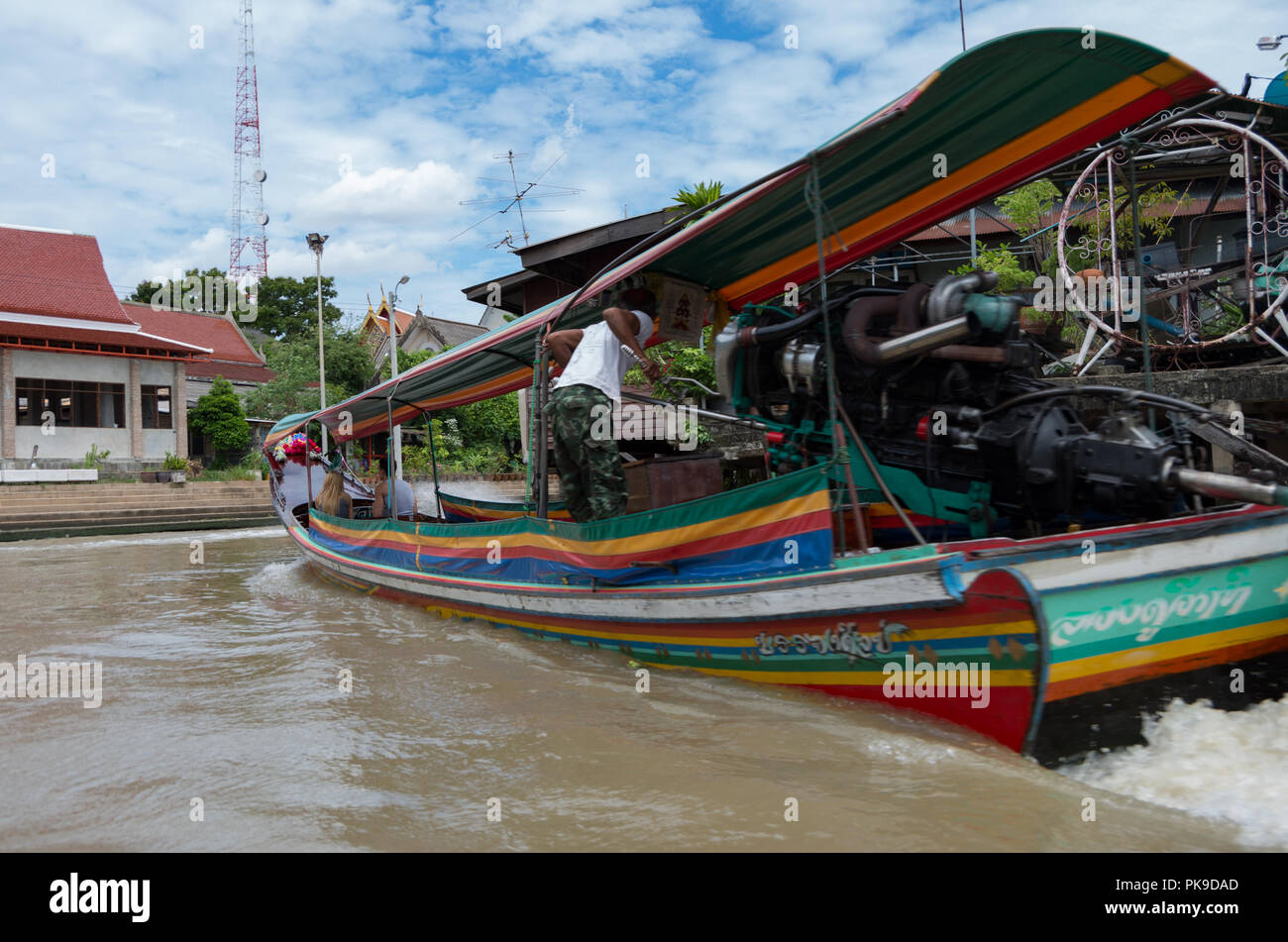 A colourful long boat racing through the canals of Bangkok, Thailand Stock Photo