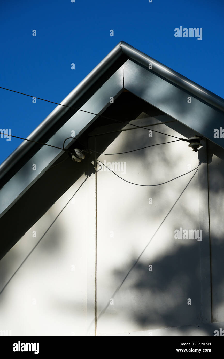 electricity power supply cables arriving at a small country house in