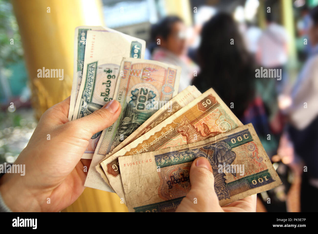 Myanmar banknotes (MM, MMR ,Kyat)  were unfolded in hand Stock Photo