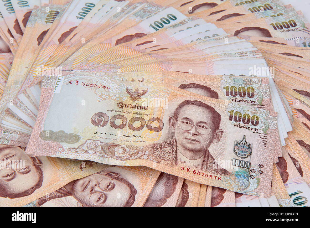 Currency the 1000 Baht of Thailand banknotes lay spread double. Stock Photo