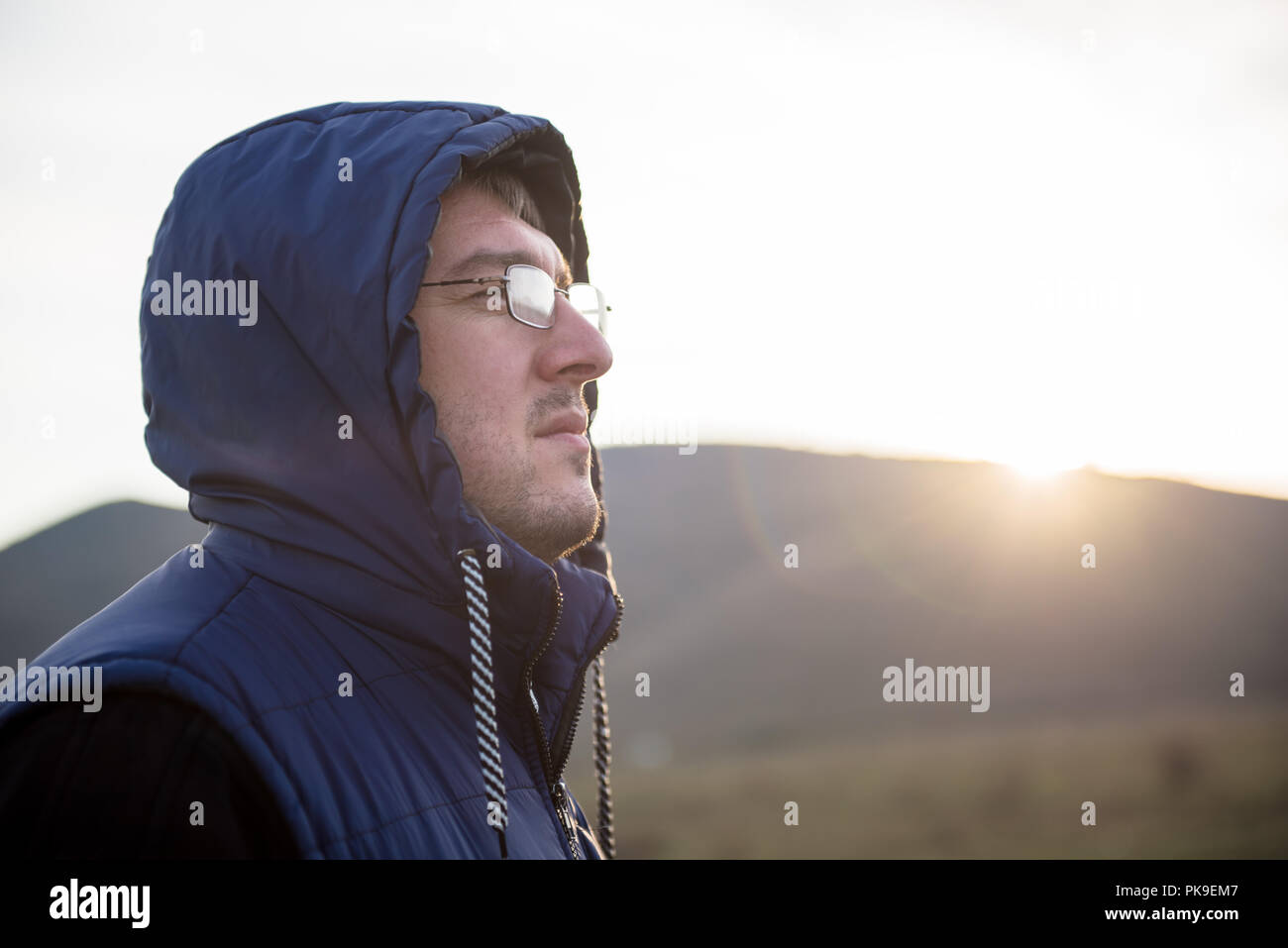 jacket with glasses in hood