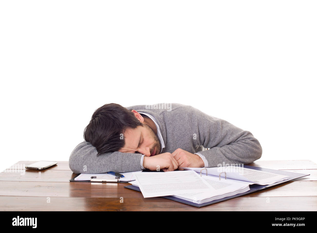 Casual Man Sleeping On A Desk Isolated On White Background Stock