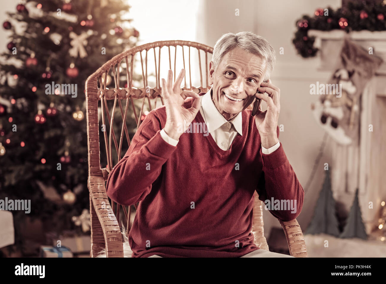 Pleasant aged man having conversation and gesticulating. Stock Photo