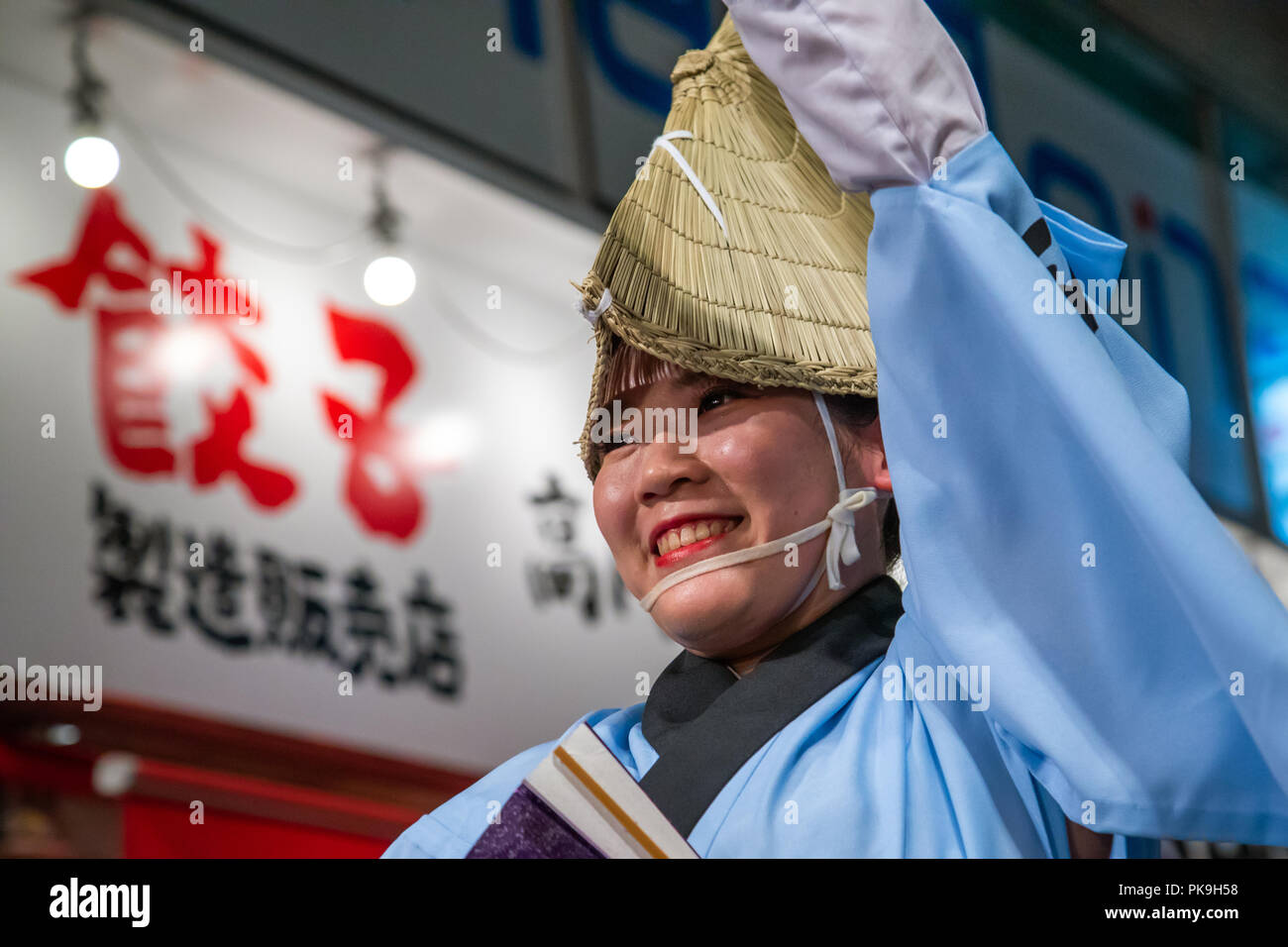 Japanese woman with straw hat during the Koenji Awaodori dance summer street festival, Kanto region, Tokyo, Japan Stock Photo