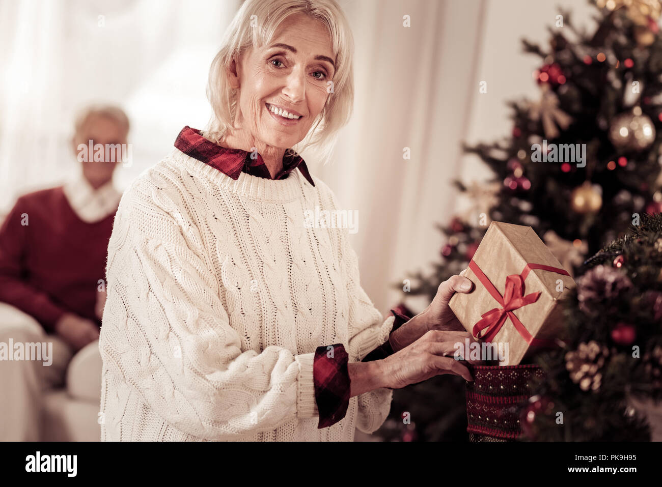 Happy mature woman christmas tree hi-res stock photography and images ...