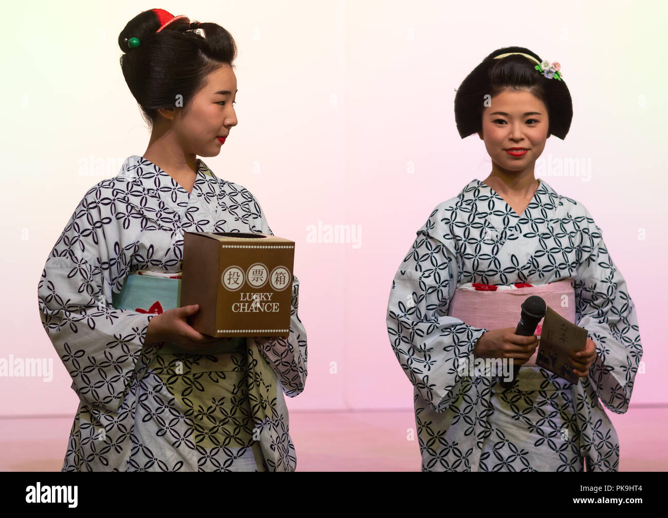 Maiko women making a game on stage, Kansai region, Kyoto, Japan Stock Photo