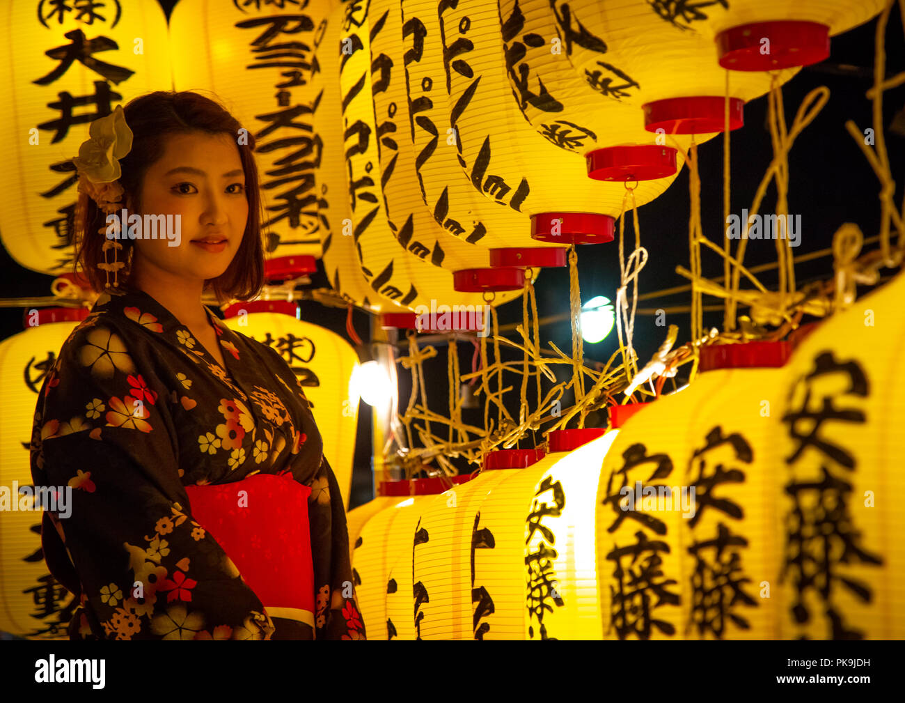 Japanese woman in yaukuta during Gokoku shrine Mitama matsuri Obon festival celebrating the return of the spirits of the deads, Kyushu region, Fukuoka Stock Photo