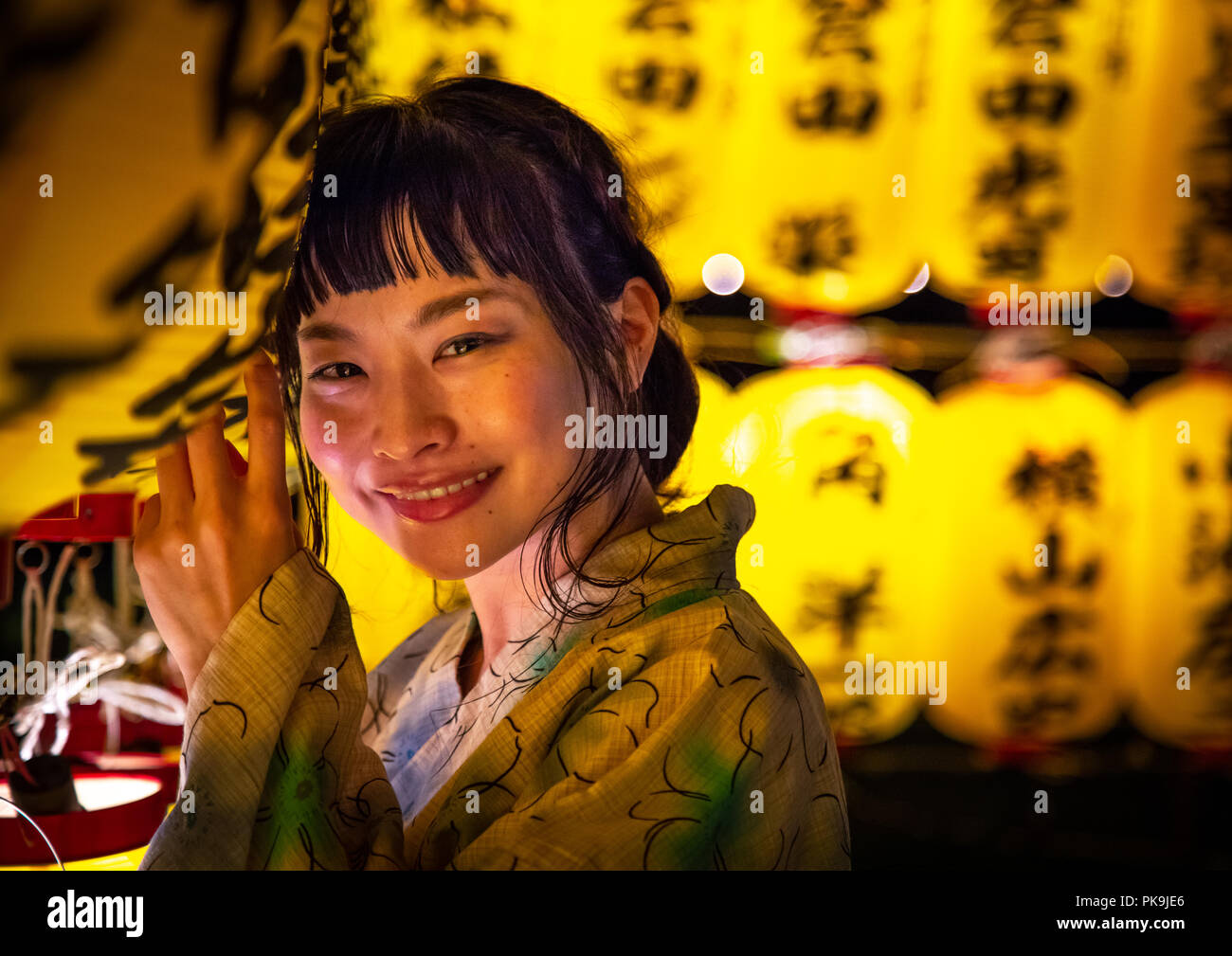 Japanese woman in yaukuta during Gokoku shrine Mitama matsuri Obon festival celebrating the return of the spirits of the deads, Kyushu region, Fukuoka Stock Photo