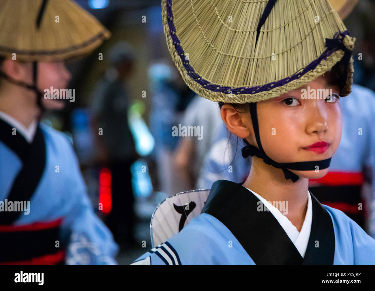 Japanese child with straw hat during the Koenji Awaodori dance summer street festival, Kanto region, Tokyo, Japan Stock Photo
