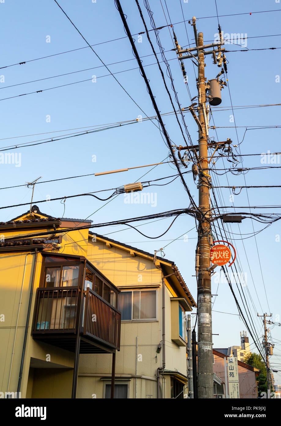 Tangled wires on electric pole in Kazue-machi chaya geisha district, Ishikawa Prefecture, Kanazawa, Japan Stock Photo