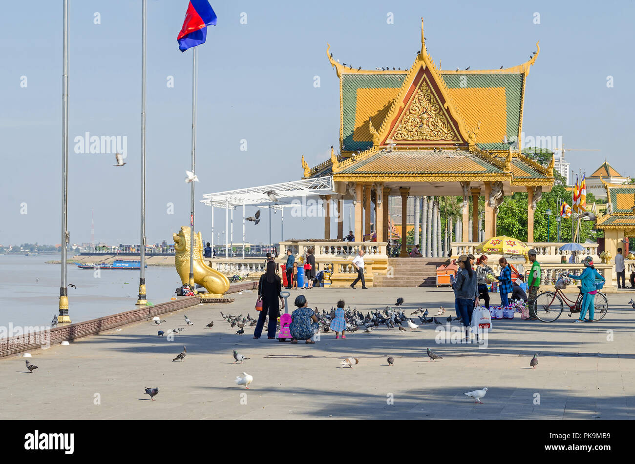 Phnom Penh, Cambodia - April 9, 2018: Preah Sisowath Quay, a riverside public promenade along the  Tonle Sap river with an open space in front of the  Stock Photo