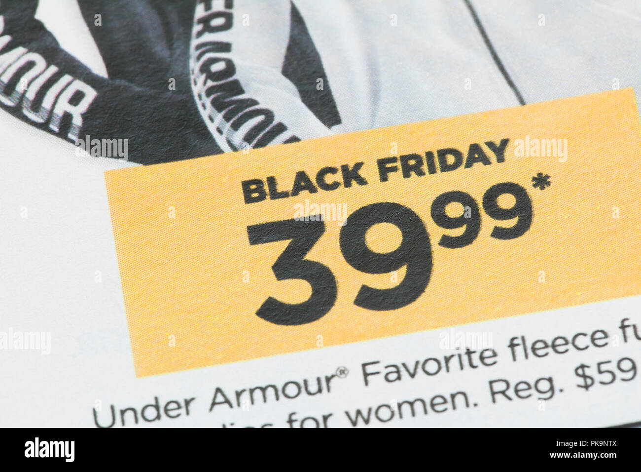 Black Friday sale ad on clothing in weekly mailer - USA Stock Photo