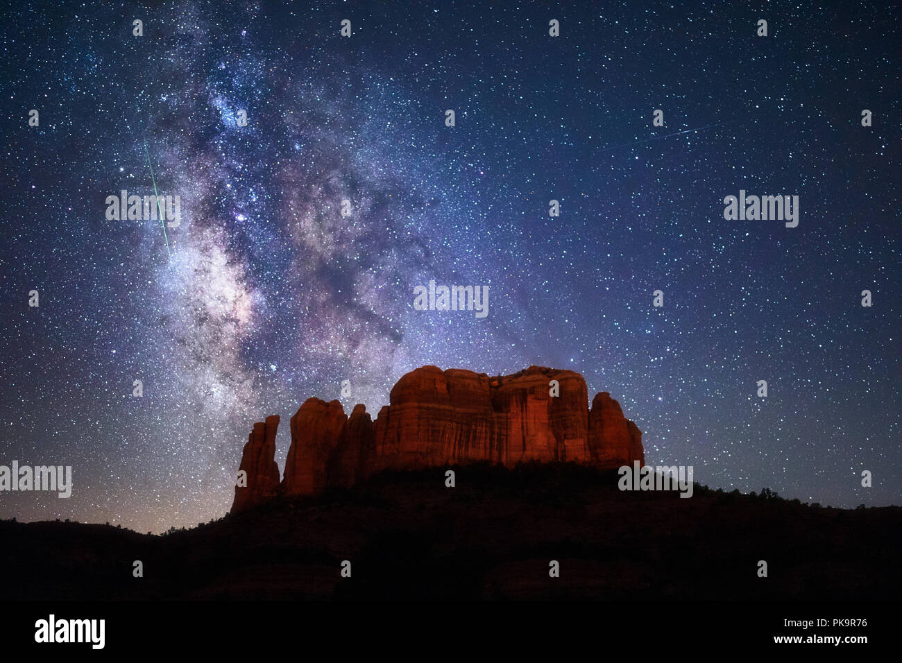 Meteor in the Milky Way above Cathedral Rock in Sedona, Arizona Stock Photo