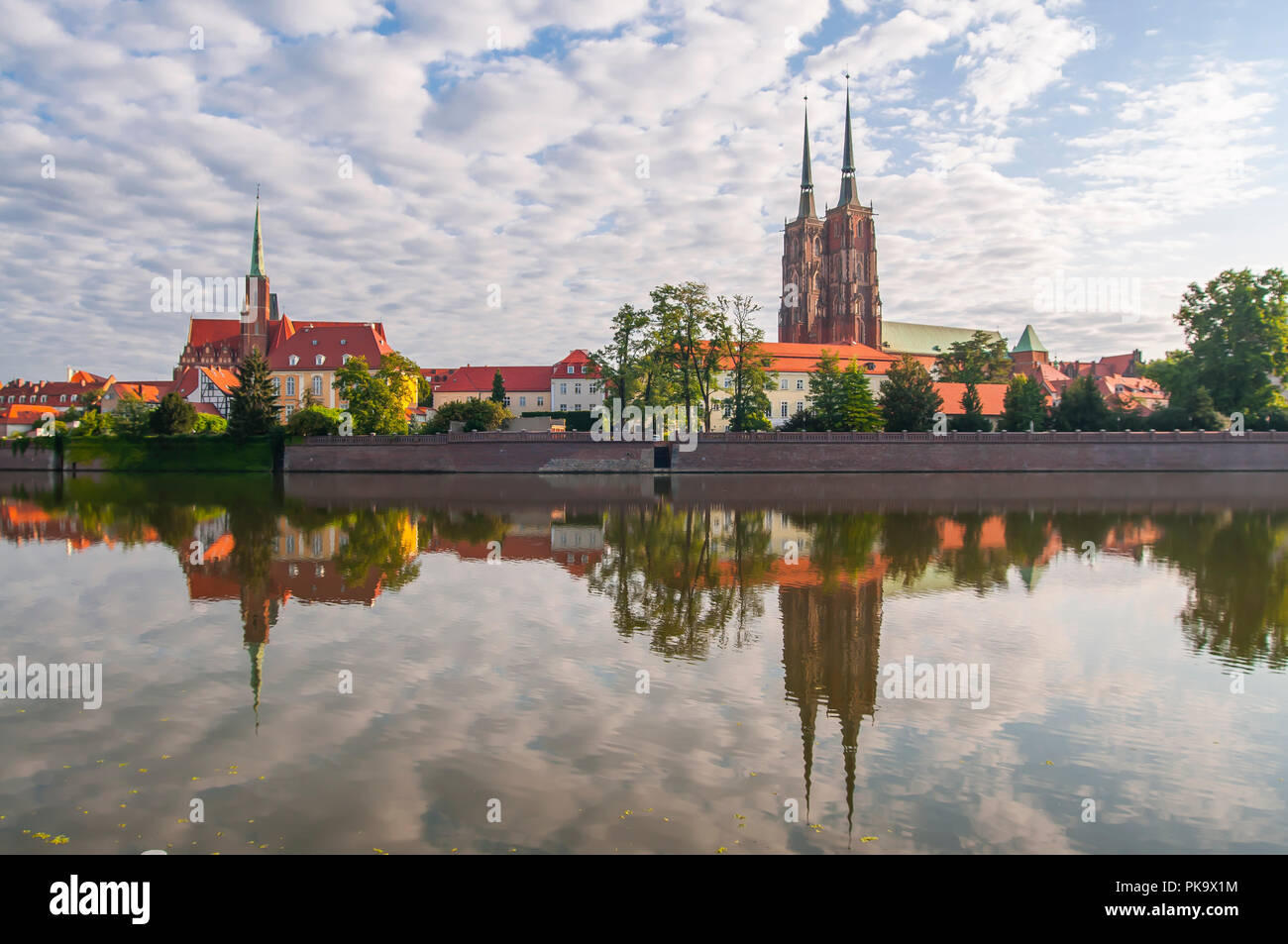 Gothic cathedral of St. John the Baptist reflection in Odra River ...