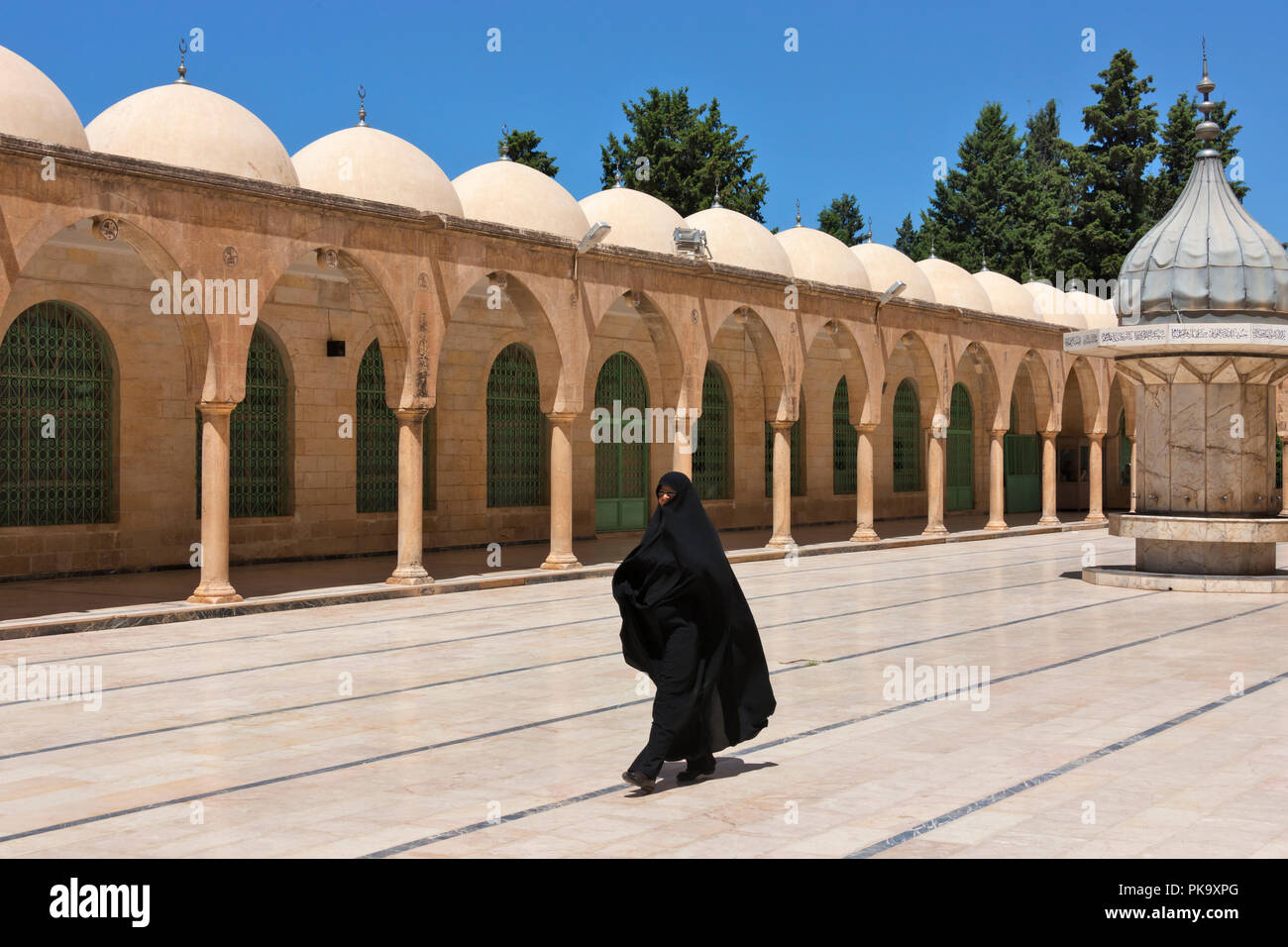Muslim woman in Halil-ur Rahman Mosque, Sanliurfa, Turkey Stock Photo