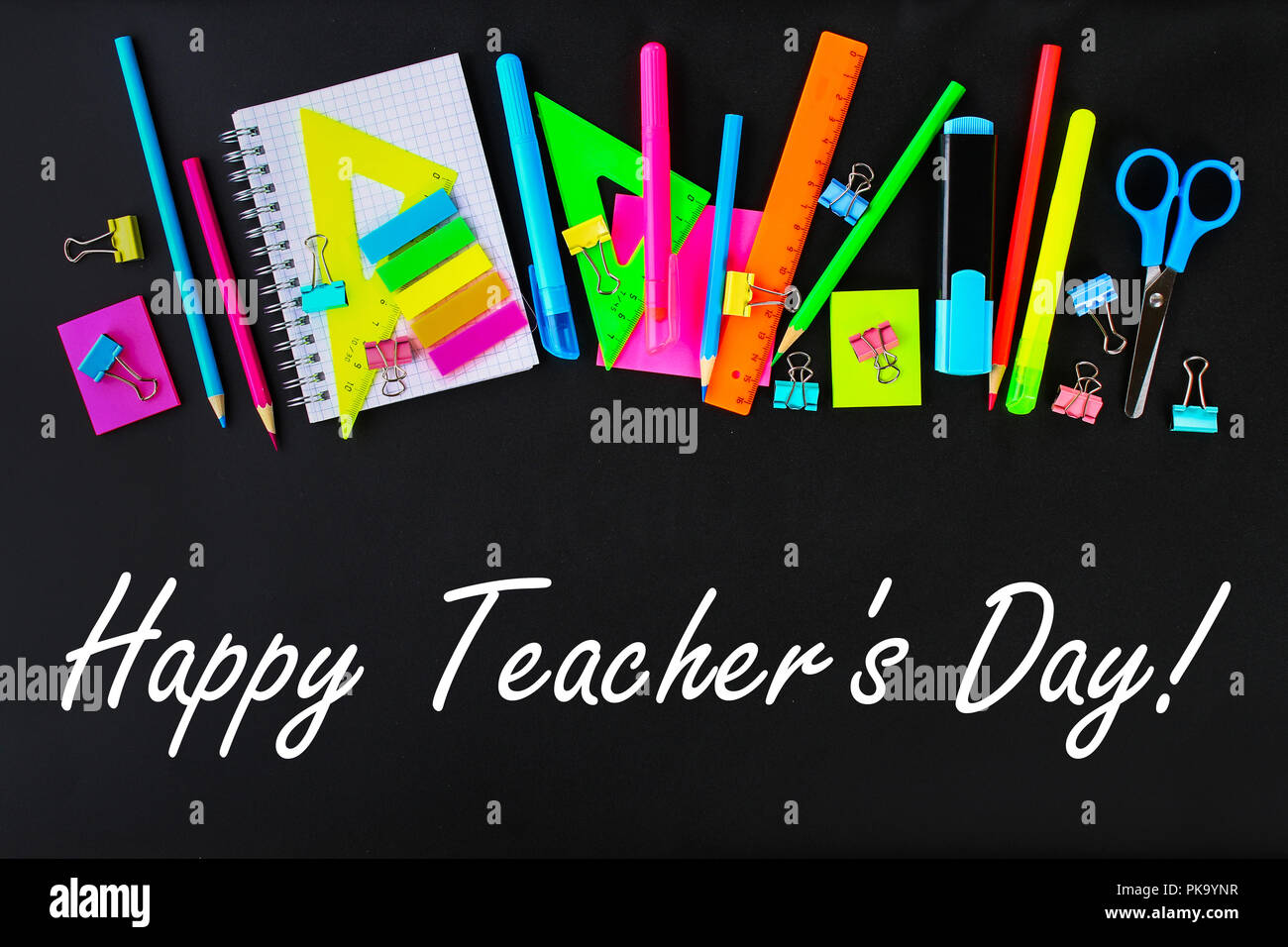 Happy Teachers Day. School supplies on blackboard background ready for your  design. Flat lay. Top view Stock Photo - Alamy