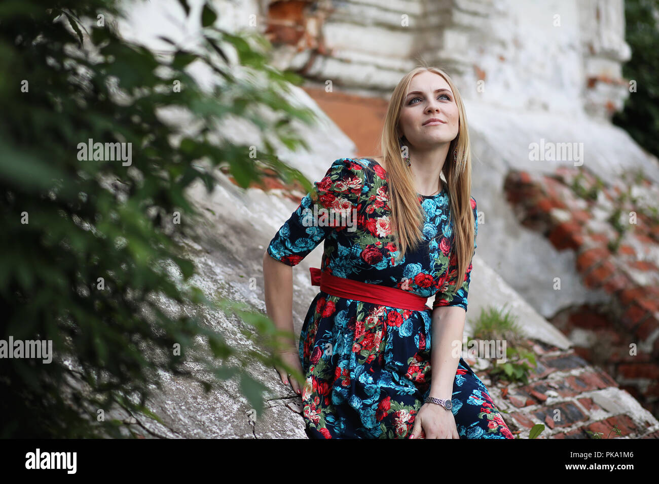 Girl in the street with an umbrella Stock Photo - Alamy