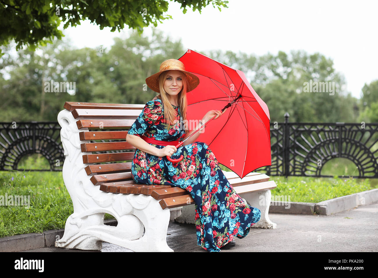Girl in the street with an umbrella Stock Photo - Alamy