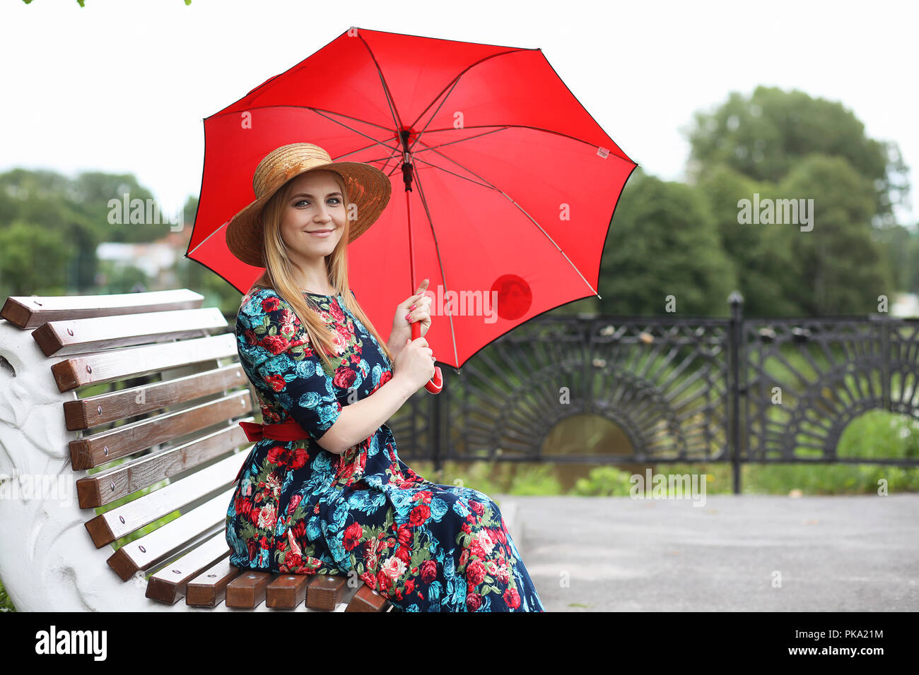 Girl in the street with an umbrella Stock Photo - Alamy