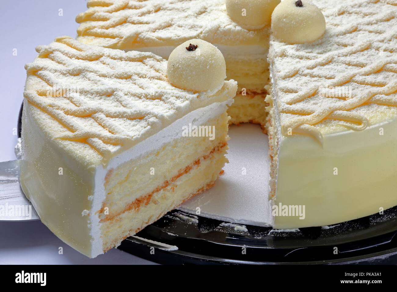 Cake with milk powder coating Stock Photo - Alamy