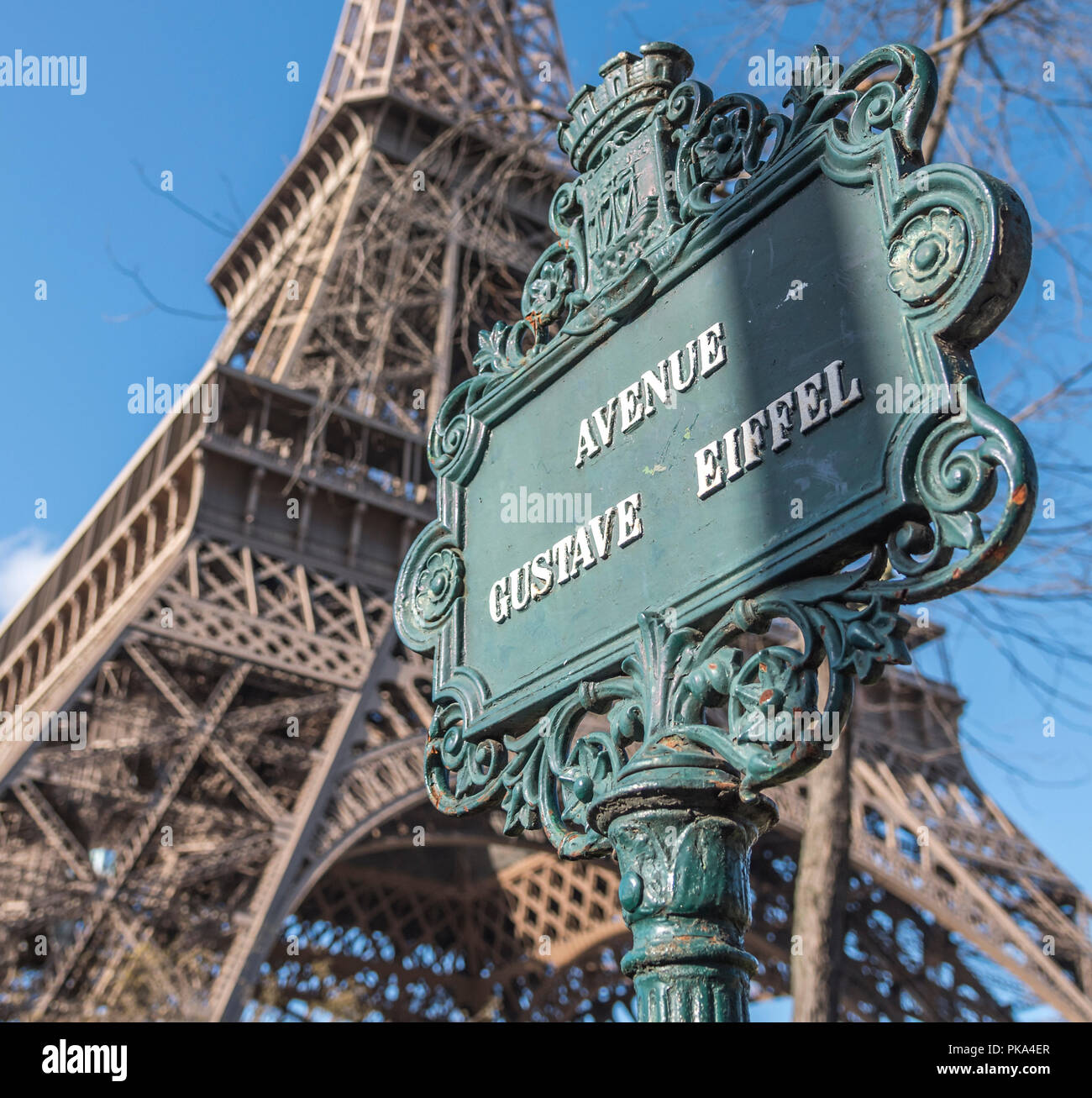 Avenue Gustave Eiffel street sign with the Eiffel Tower out of focus in the background. Stock Photo