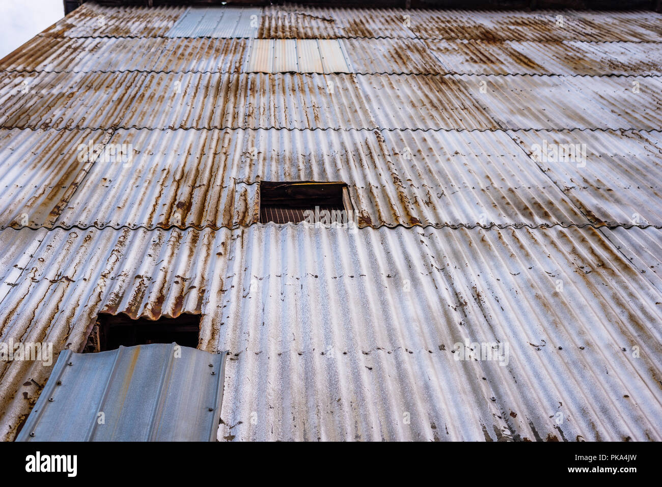 Looking up the exterior of a building clad in corrugated metal. Stock Photo