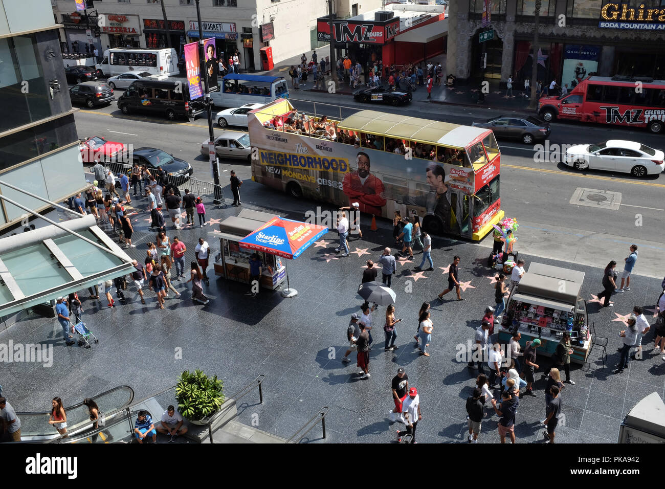 HOLLYWOOD - SEPT 2, 2018: Hollywood Blvd with tourists and tour busses and the Walk of Fame at the Hollywood and Highland Center. Stock Photo
