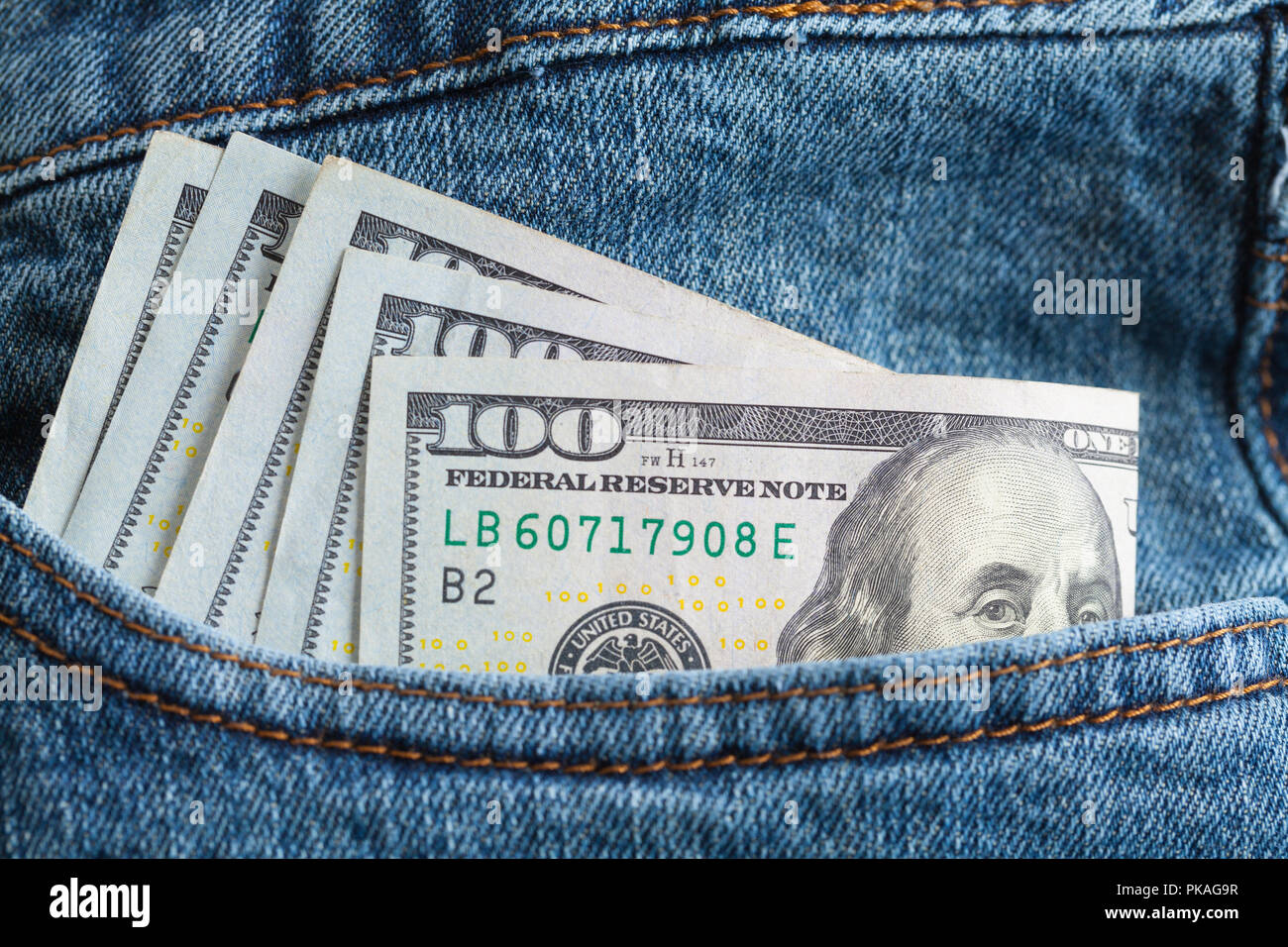 Folded Five Hundred Dollars in Blue Jeans Pocket, Stock Photo