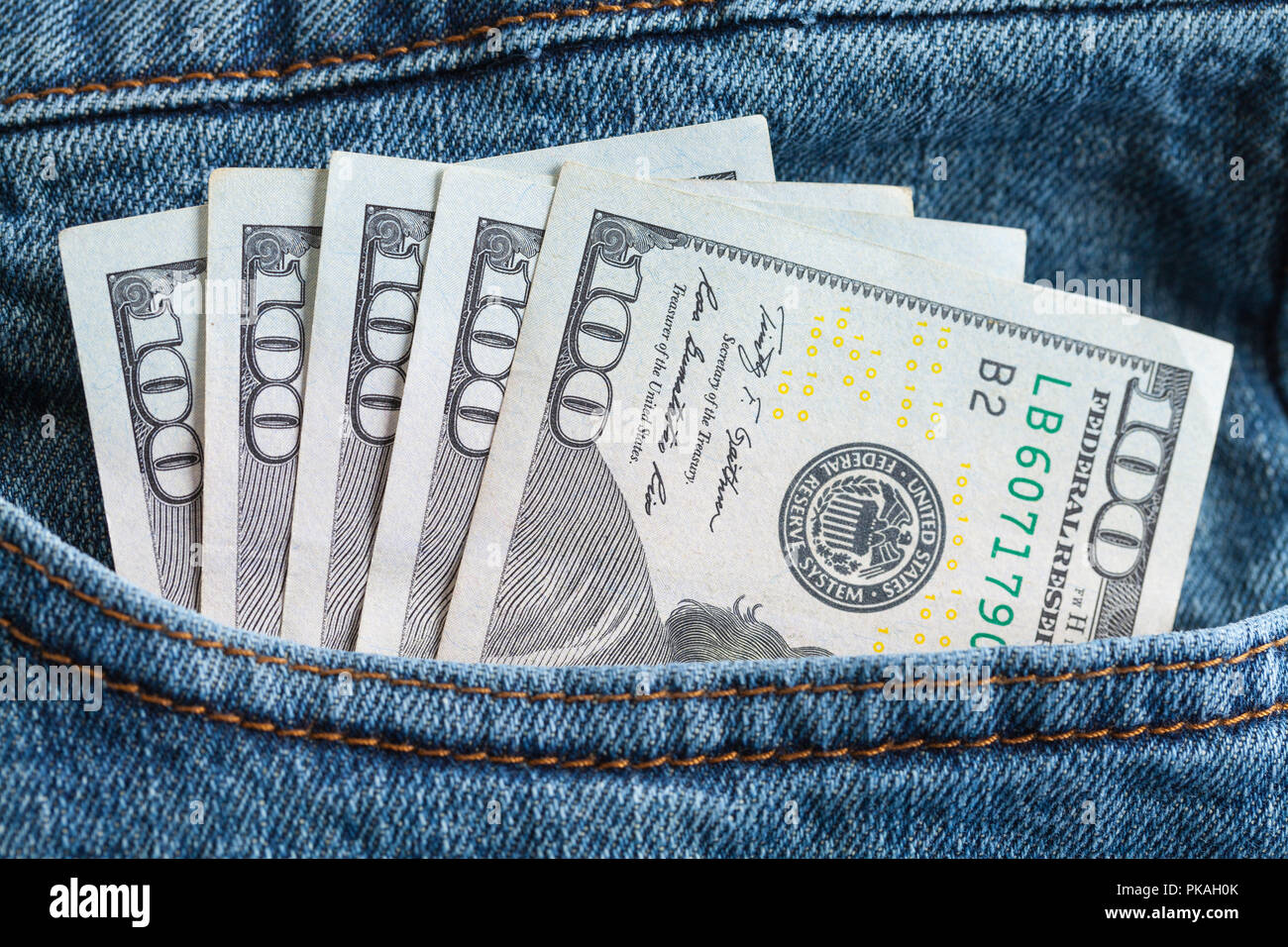 Blue Jeans with Five Hundred Dollar Bills. Stock Photo