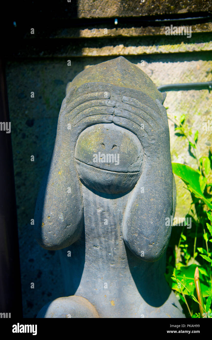 Indonesian historical statue nearby the beach of the Bali island