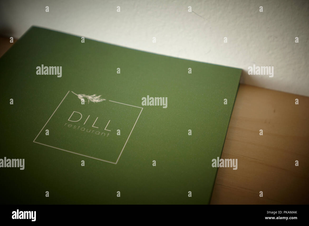 The green menu with the logo of Dill Restaurant in Reykjavik, Iceland