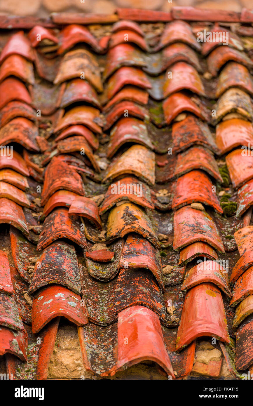 clay old shingles on the roof of an old house closeup Stock Photo
